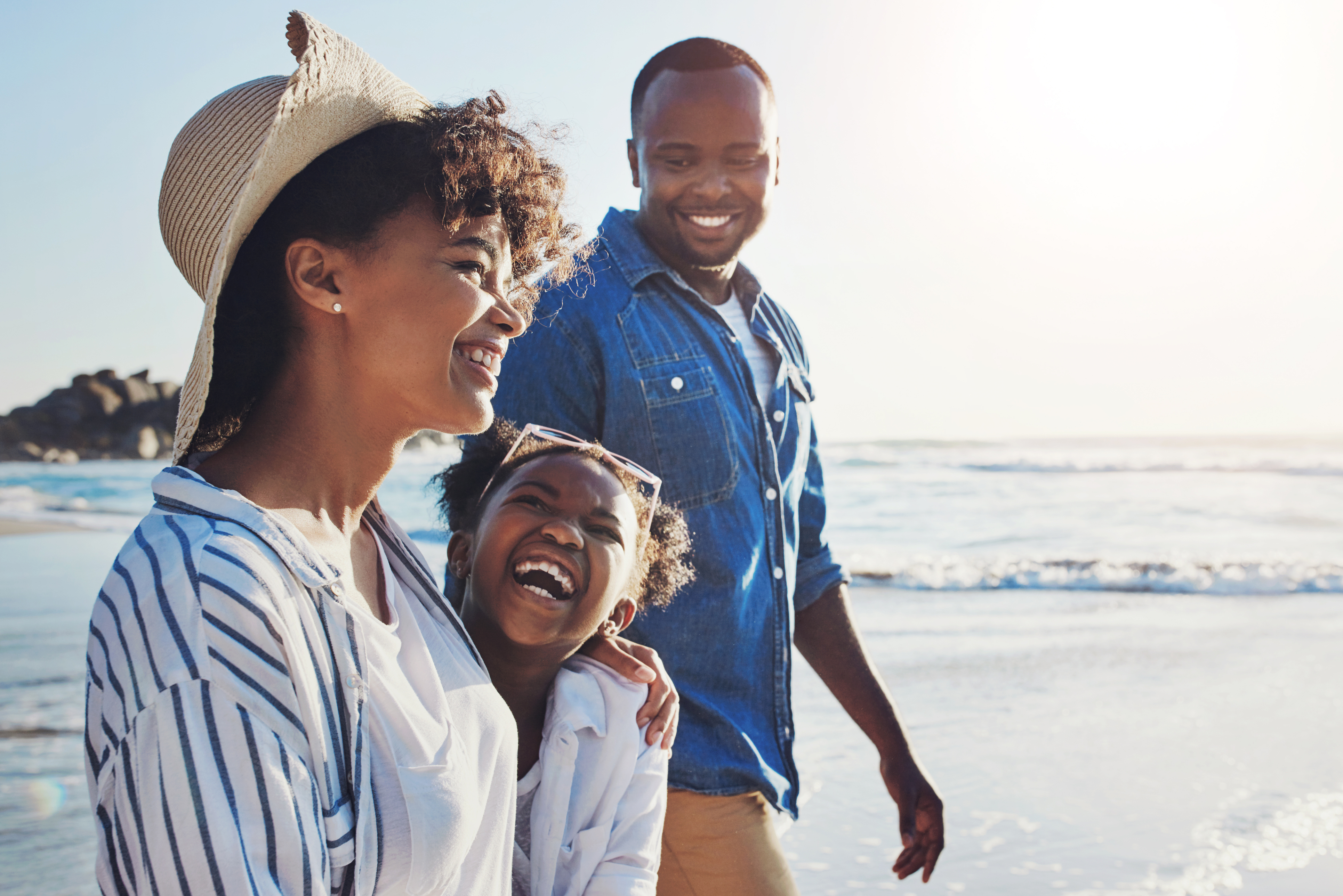 Parents and daughter at beach